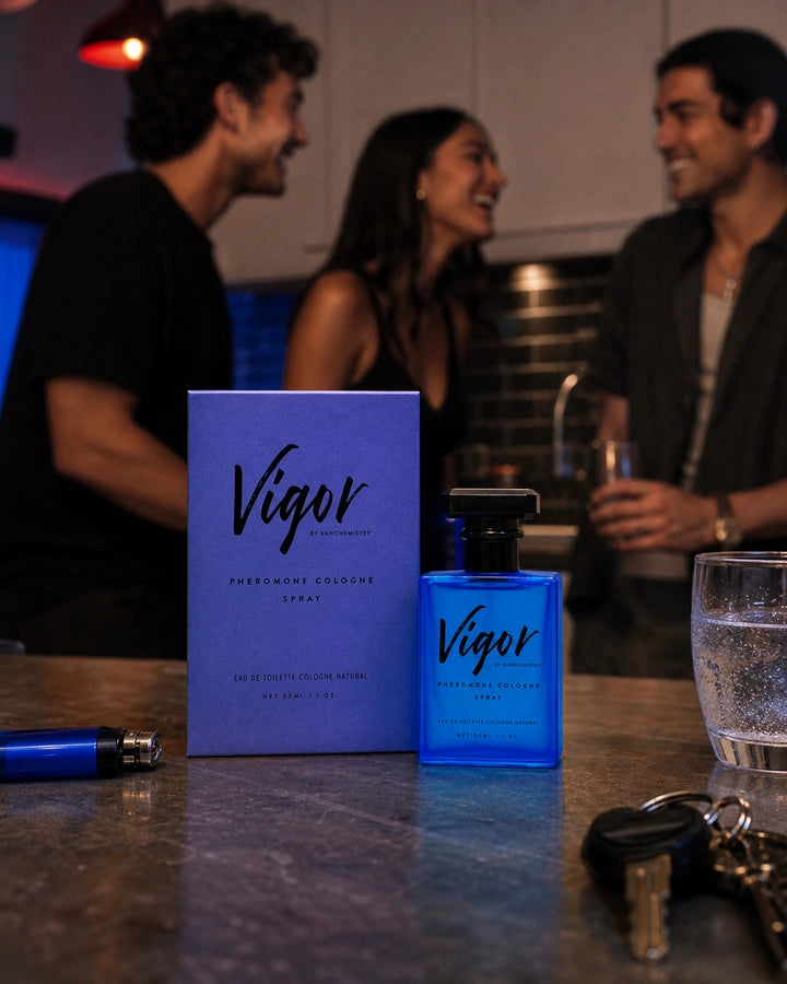 Vigor cologne and carton beside a denim jacket and headphones