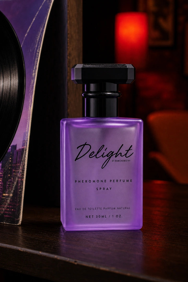 Delight perfume and carton with bright earrings and a lipstick