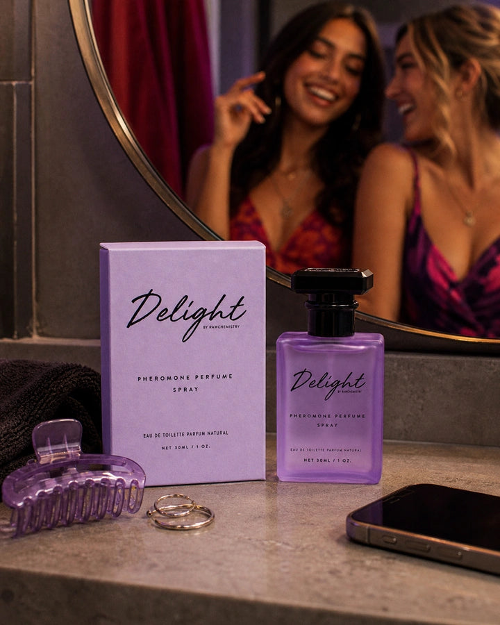 Delight perfume and carton with bright earrings and a lipstick