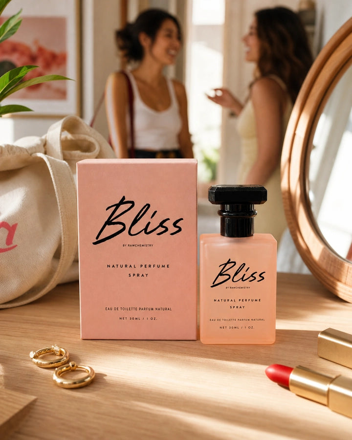 Bliss perfume and carton in a bright, playful vanity scene