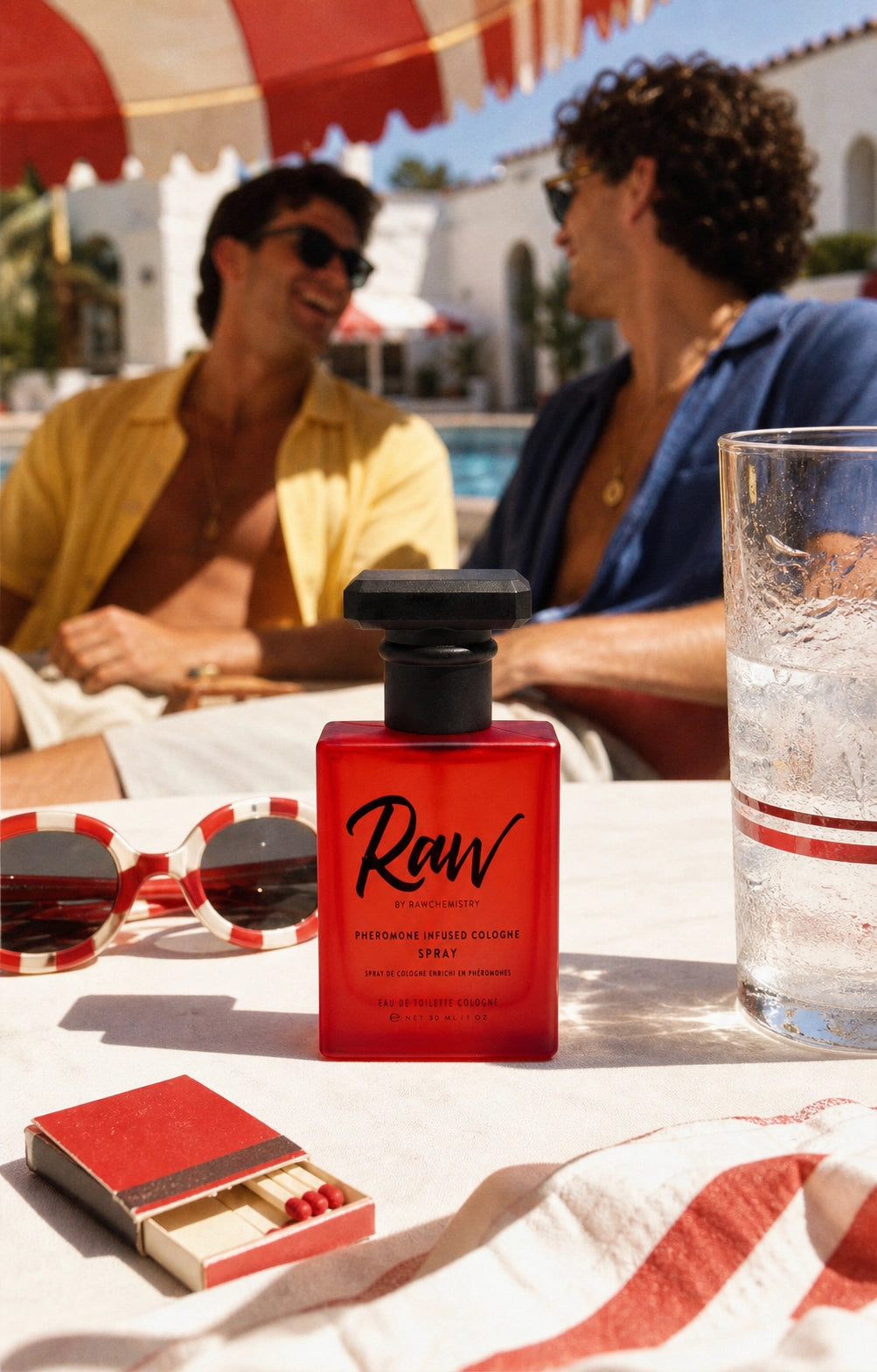 RAW cologne and carton at a colorful vintage motel pool