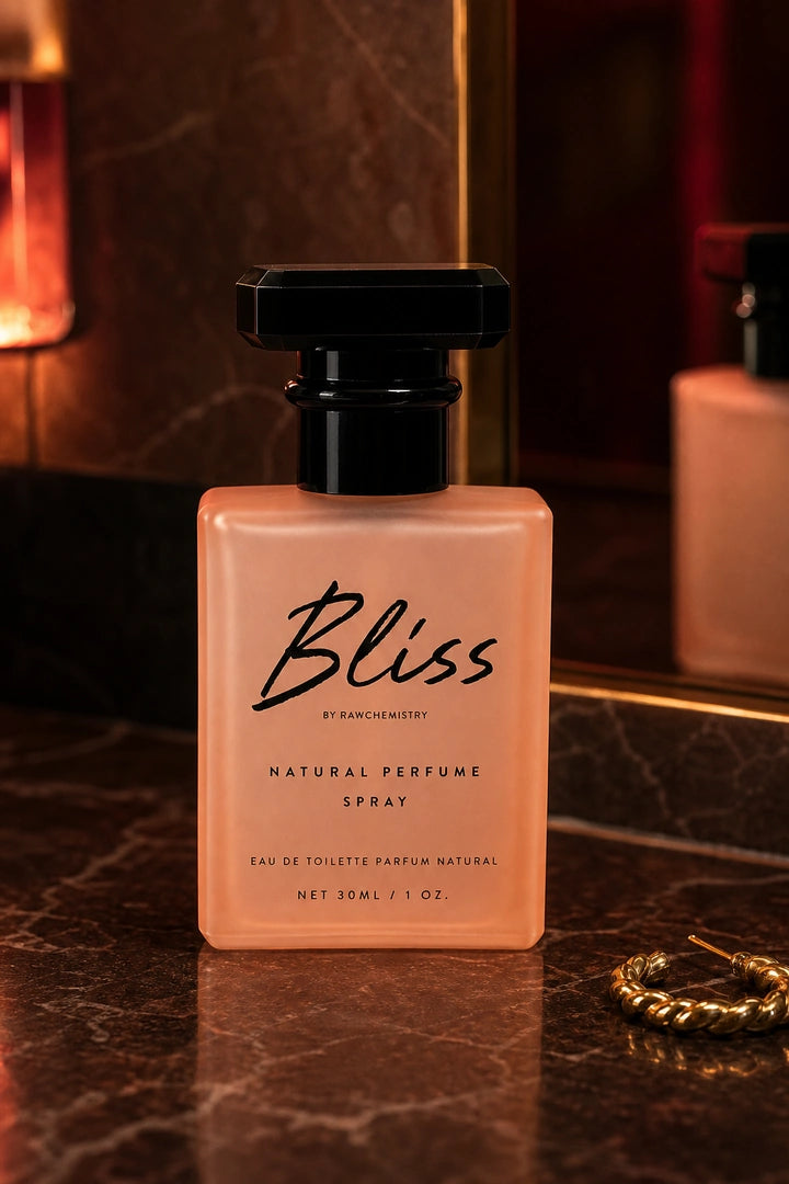 Bliss perfume and carton on a playful getting-ready vanity