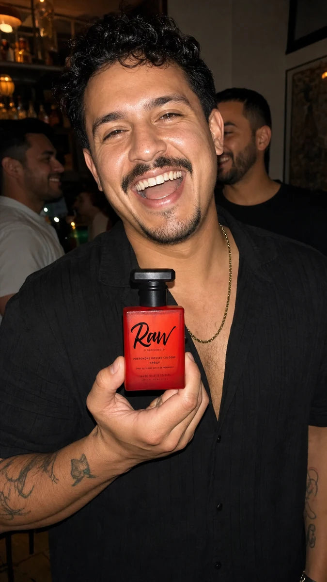 RAW customer holding the red cologne bottle during a night out