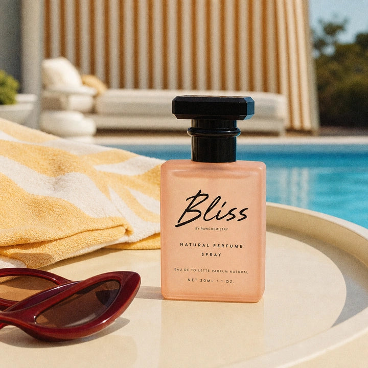 Bliss perfume photographed at a sunlit private pool club