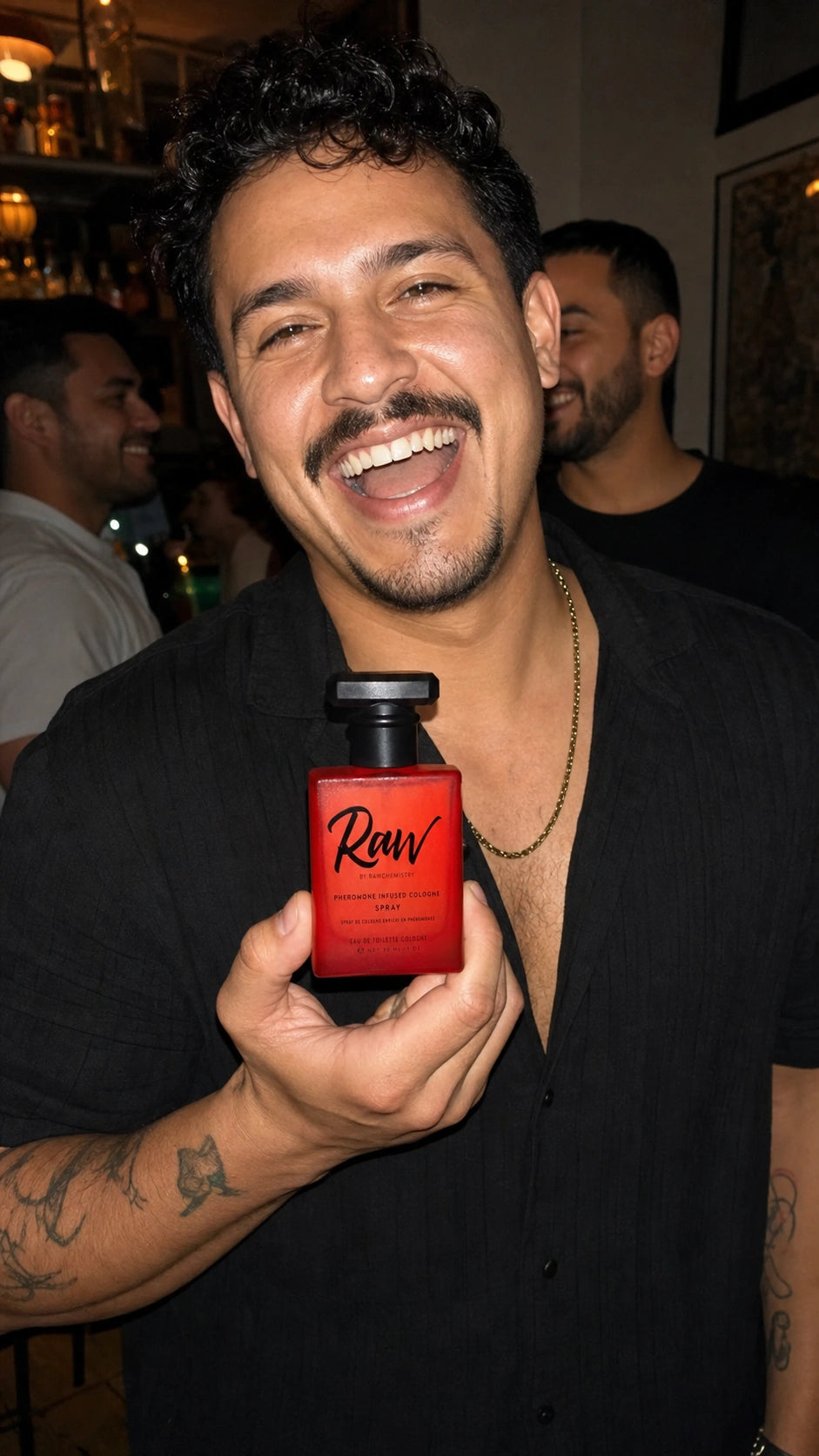Marco holding Raw at a neighborhood bar