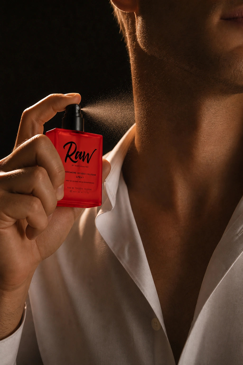 Man applying Raw cologne before going out