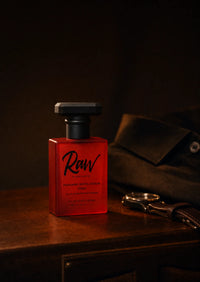 The bottle on a dark dresser at night