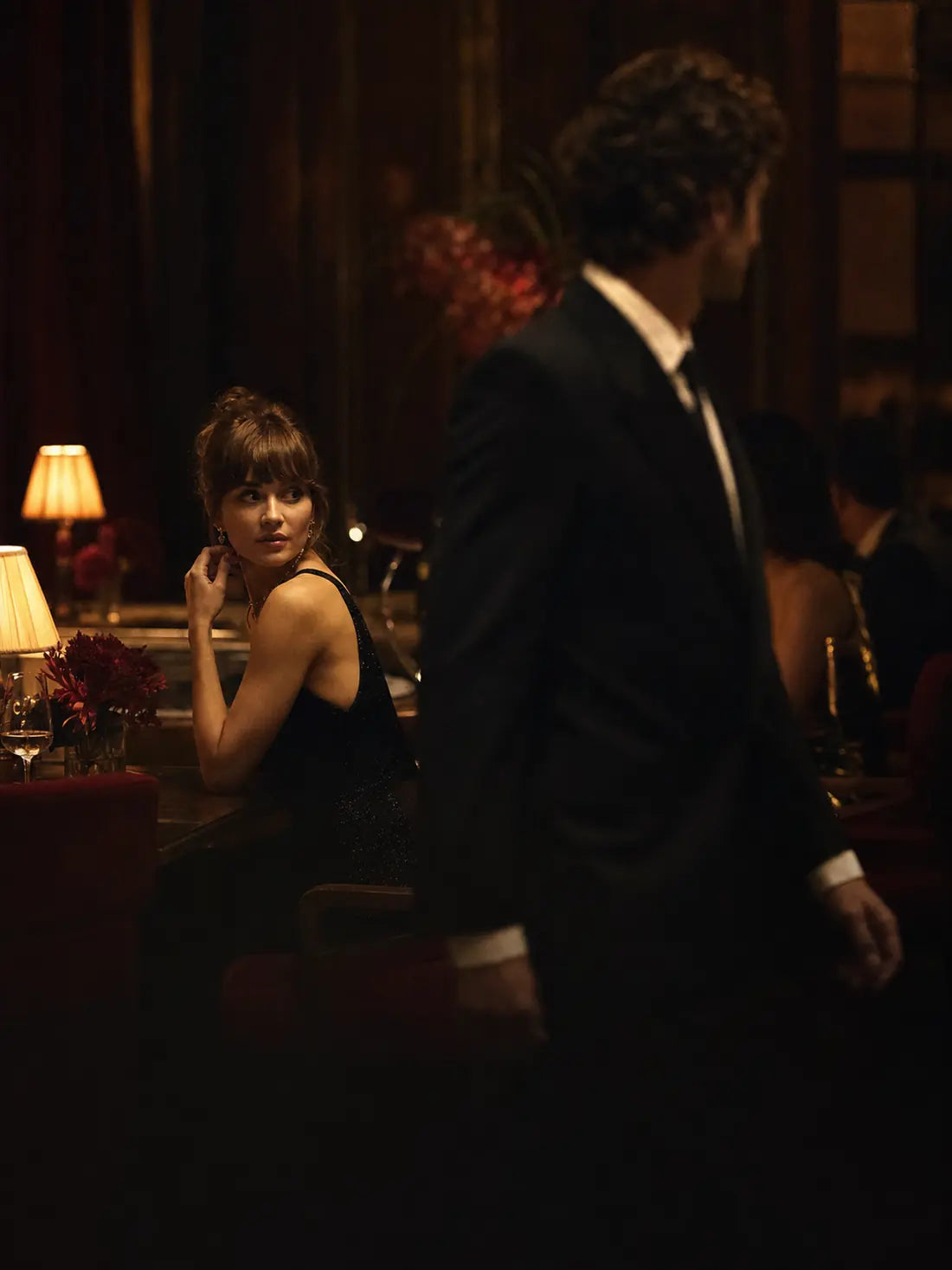 She notices him as he passes in an intimate restaurant